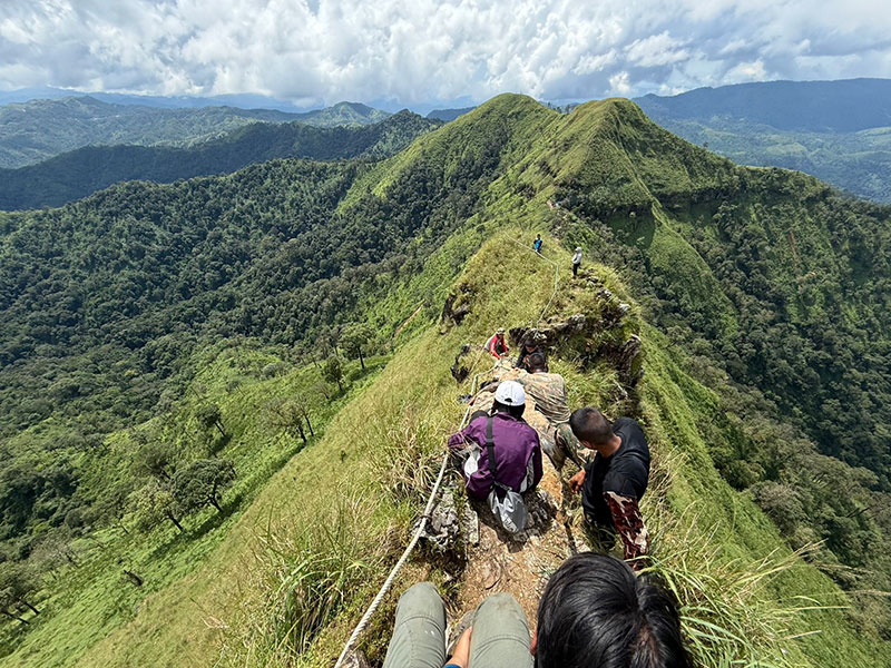 Hikers crossing the Khao Chang Phueak ridge