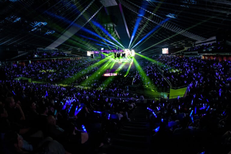 Illuminated ring and crowd inside Lumpinee Boxing Stadium