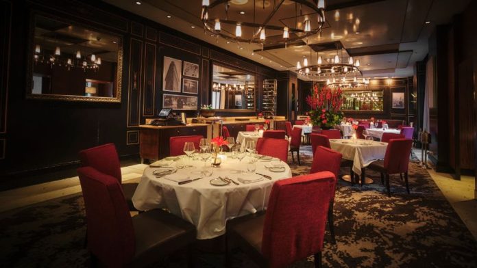 Madison Steak Avenue dining room Red chairs and set tables inside Madison Steak Avenue Bangkok