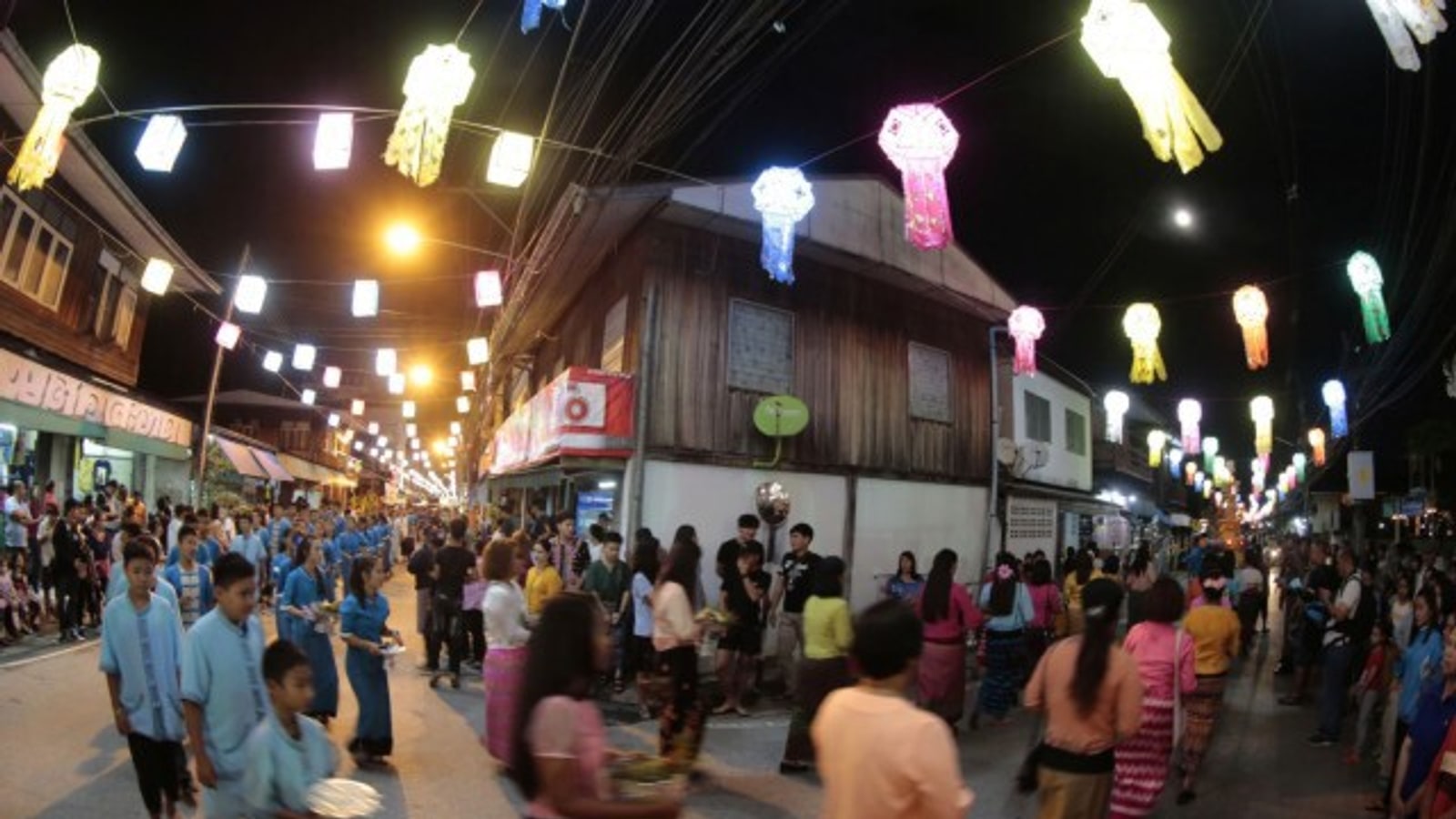 Mae Sariang street filled with glowing lanterns during Ok Wa