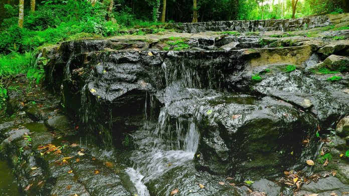 Rocky cascade in Namtok Sam Lan National Park during the green season