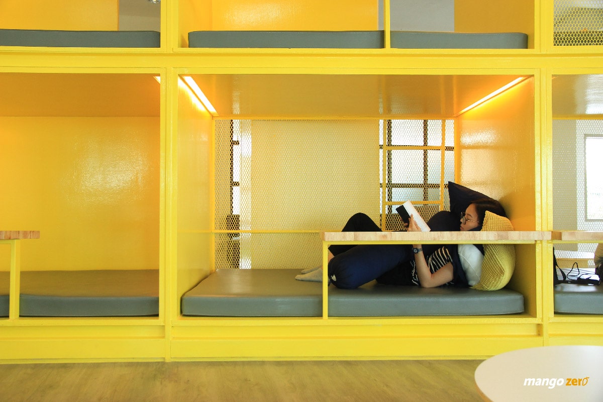A yellow cushioned rest pod inside NapLab Chula