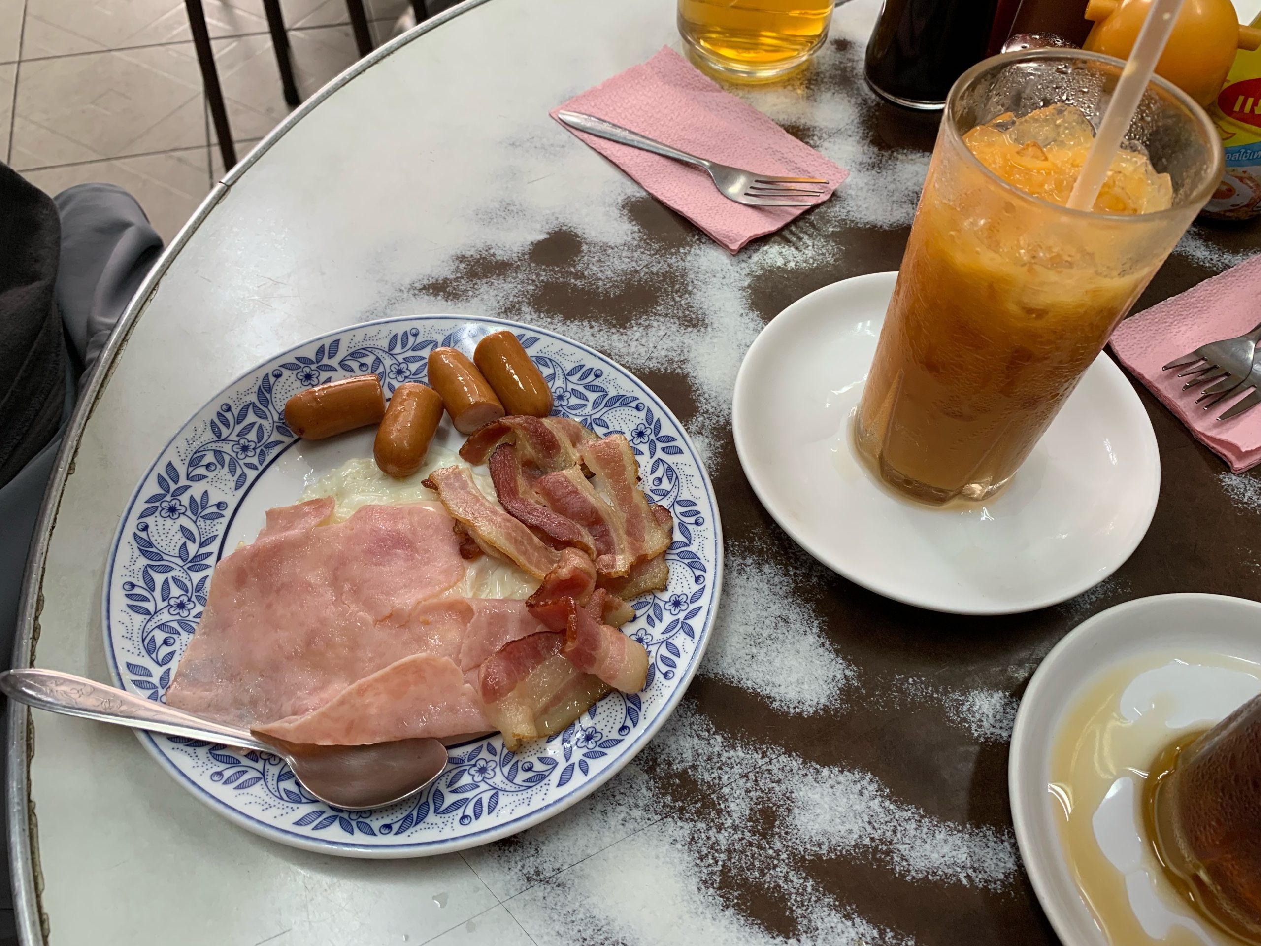 Eggs, ham, bacon and sausage served at On Lok Yun