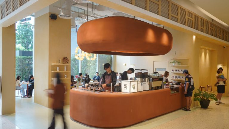 Curved coffee counter at Onibus Coffee Central Park Bangkok