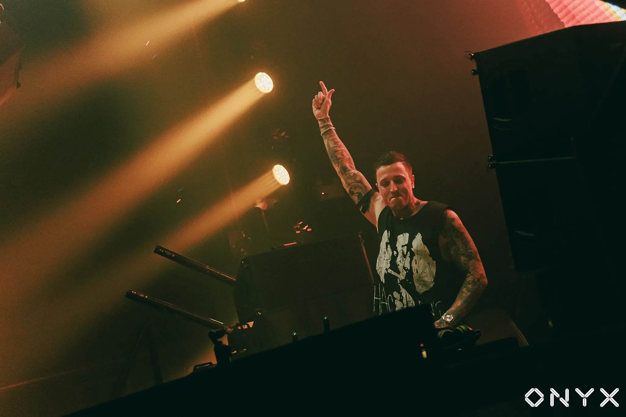 DJ performing under stage lights at ONYX Bangkok