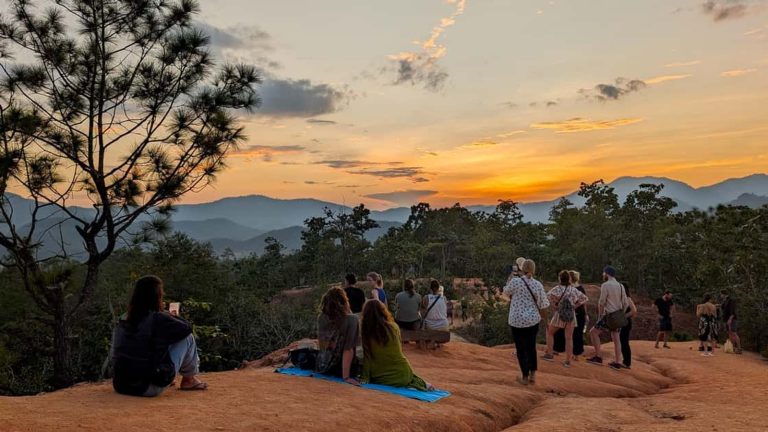 Visitors watching sunset from Pai Canyon