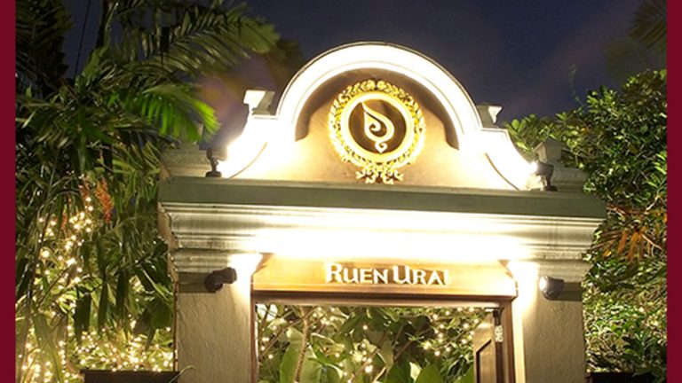 Entrance sign and garden path at Ruen Urai Bangkok