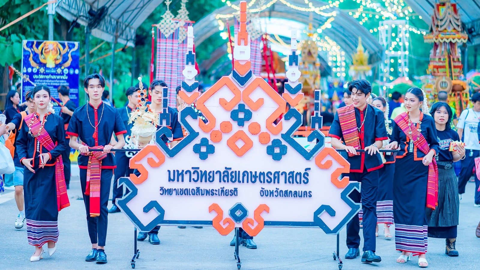 Cultural performers with a wax castle procession in Sakon Nakhon