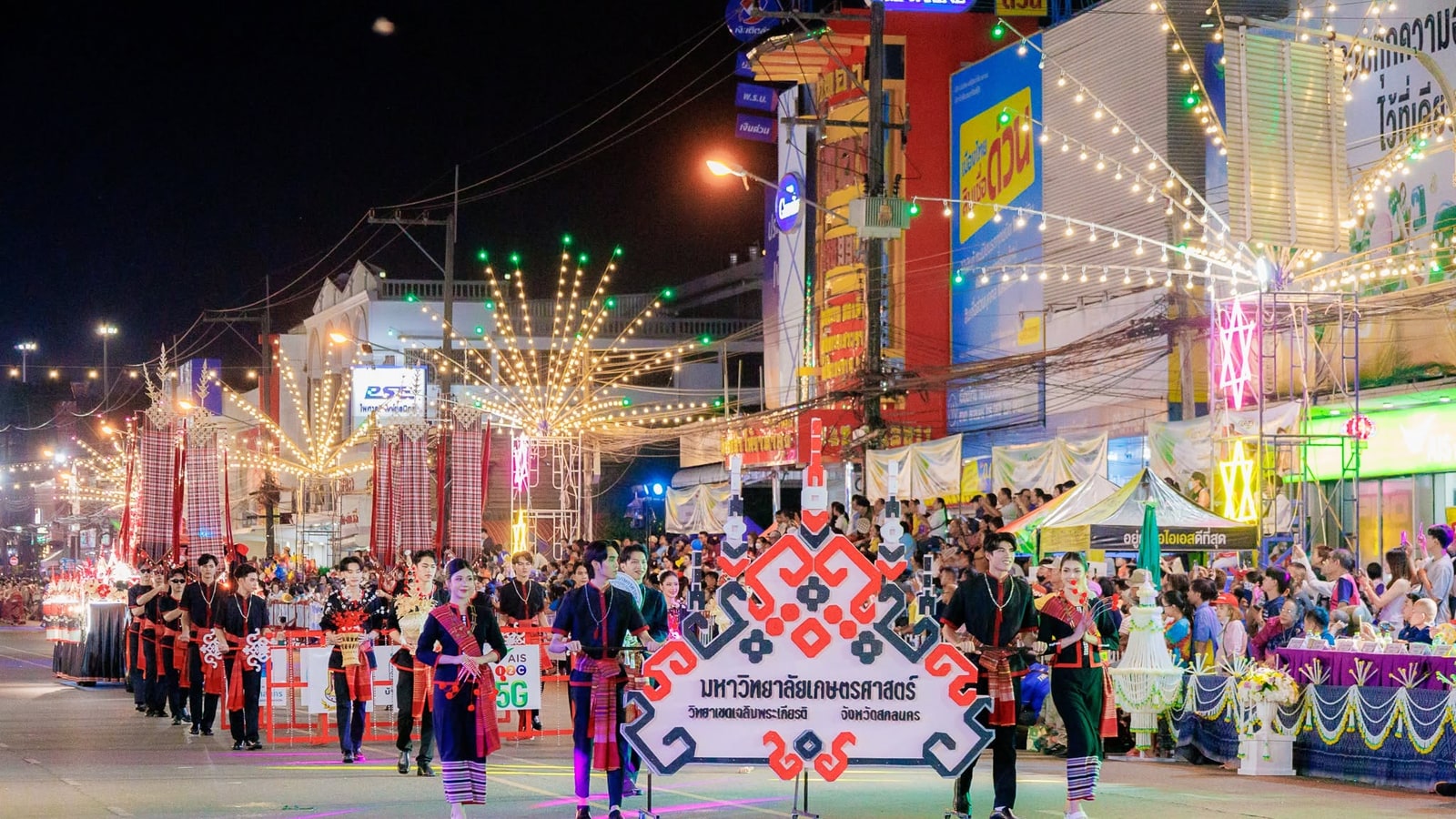 Illuminated wax castle procession through Sakon Nakhon