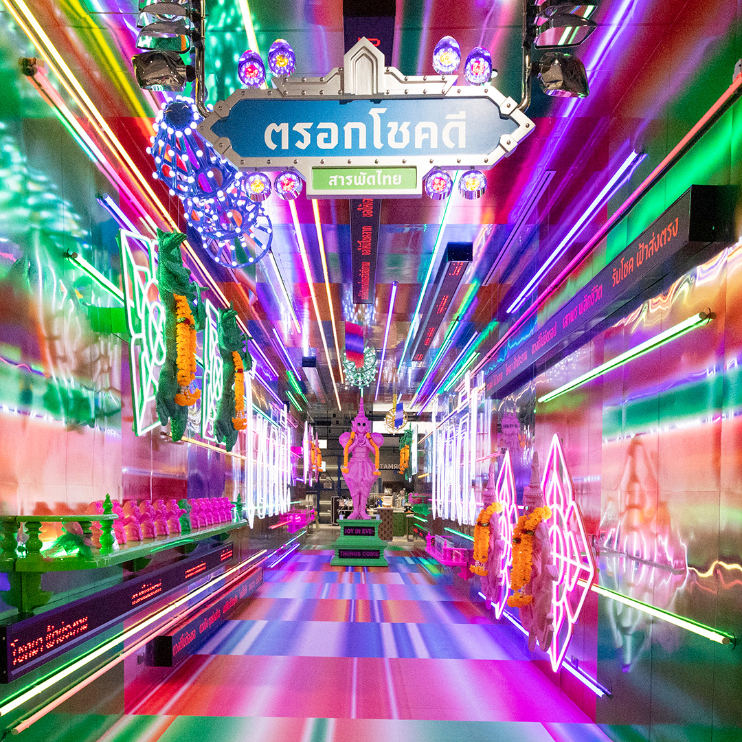 Colourful illuminated Trok Chok Dee lane inside Sarapad Thai