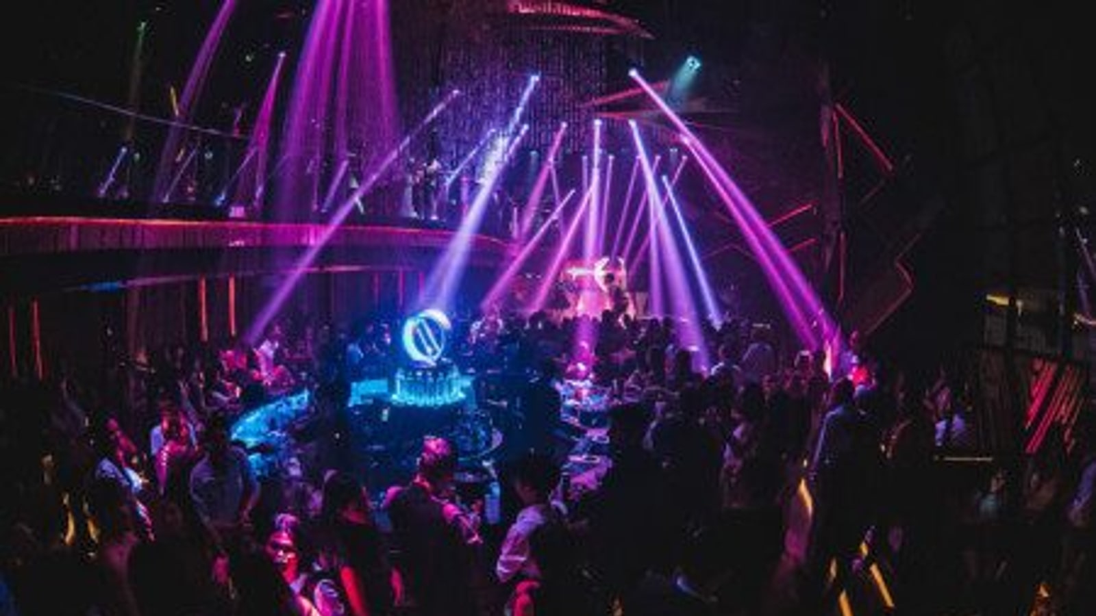 Crowded dance floor and stage lighting at Levels Bangkok
