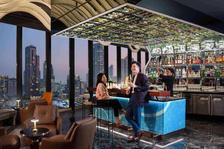 Mirrored cocktail bar and Bangkok skyline at Starlight Rooftop Bar