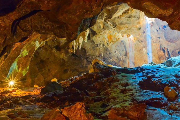 Sunlight inside Tham Pha Thai cave in Lampang