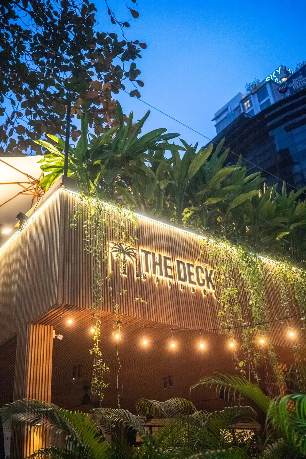 Outdoor dining at The Deck Bangkok after dark