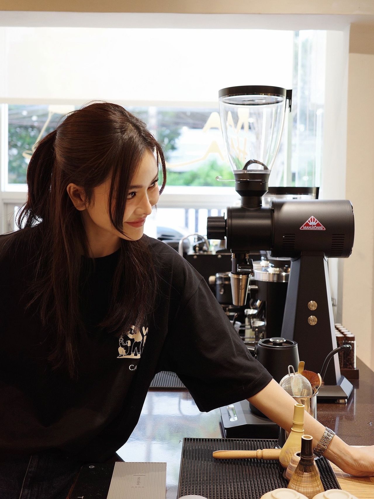 Barista working at the Waraha Cafe coffee counter